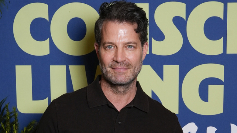 Nate Burkus poses for photos on the red carpet