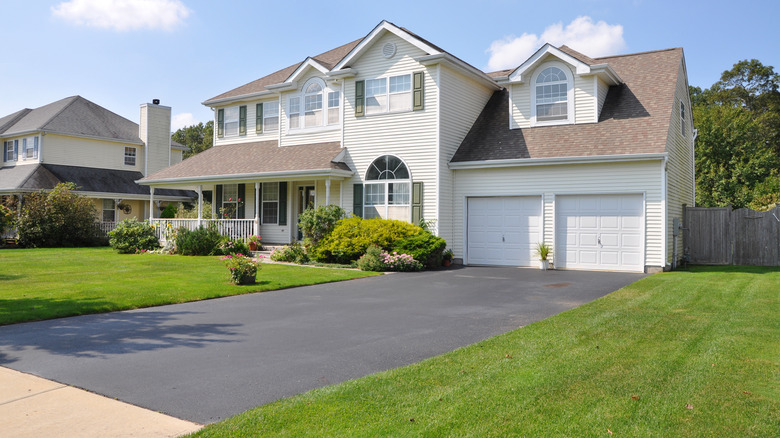 House with blacktop driveway