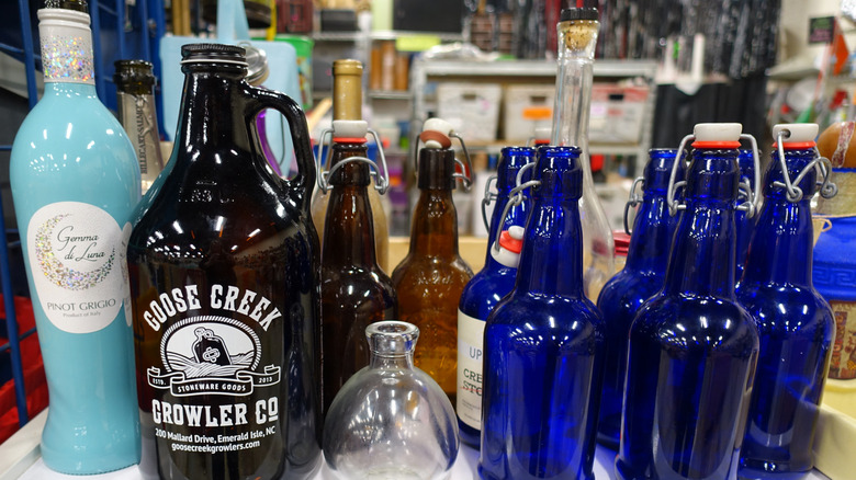 Assorted bottles on a shelf at a thrift store