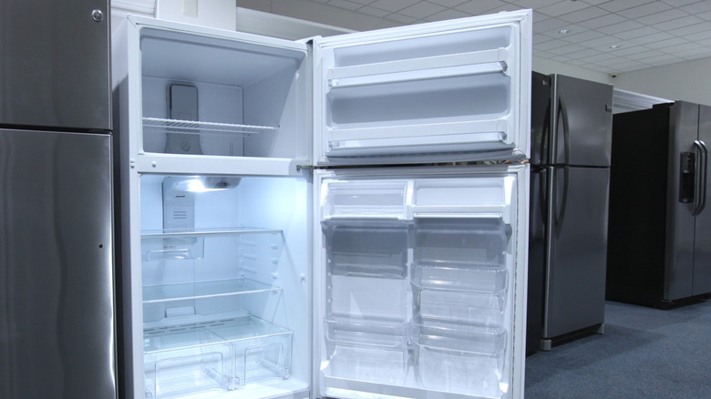 The inside of a top-freezer model Whirlpool fridge
