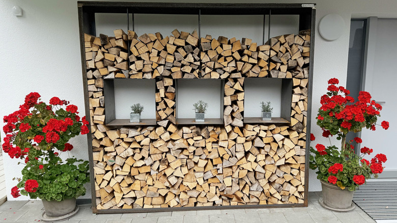 Firewood rack with potted plants