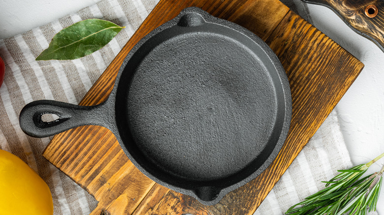 Cast iron pan on a cutting board