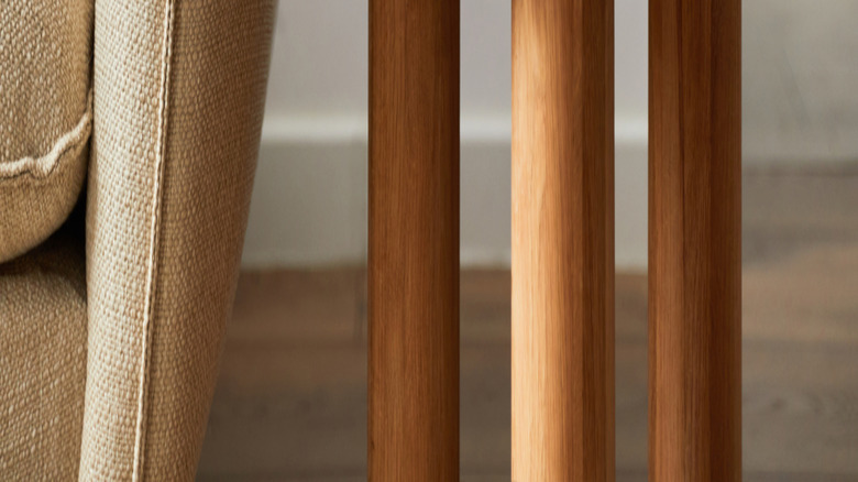 Grouping of two candles of different sizes and a tall vase on end table