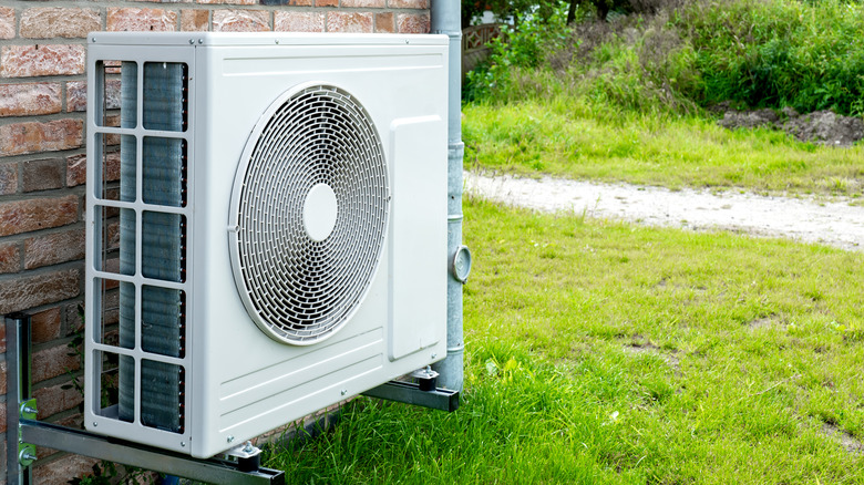 Heat pump installed next to a house