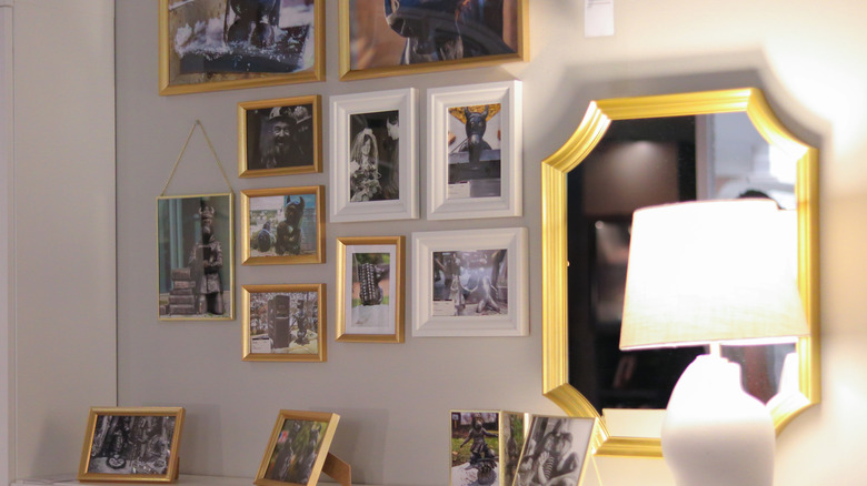 A cluttered and disorganized gallery wall.