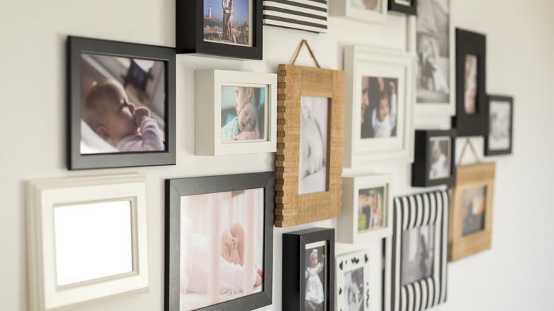 A wall covered in family photos.