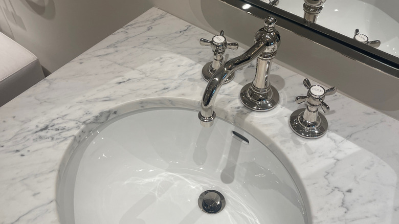 Marble sink with a polished nickel faucet
