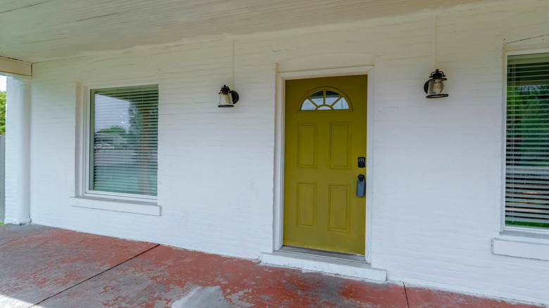 White house with olive green front door