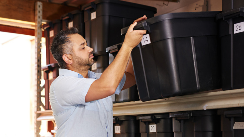 Plastic storage bins on shelf