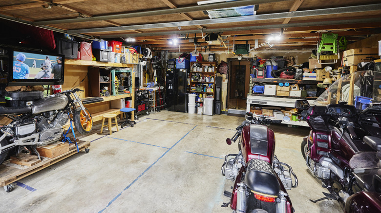 A garage with tools and motorcycles