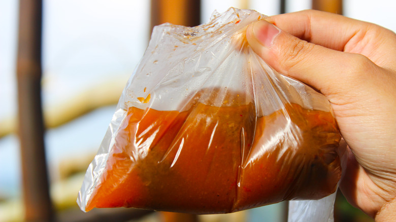 Spicy fish ball soup in a plastic bag