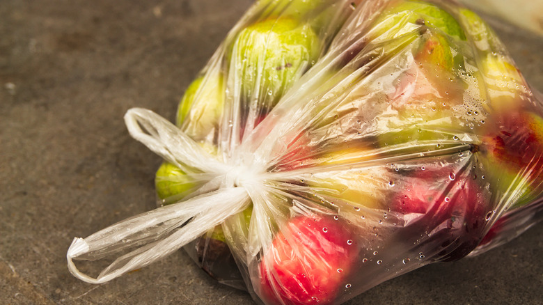 Apples tied in a clear plastic bag
