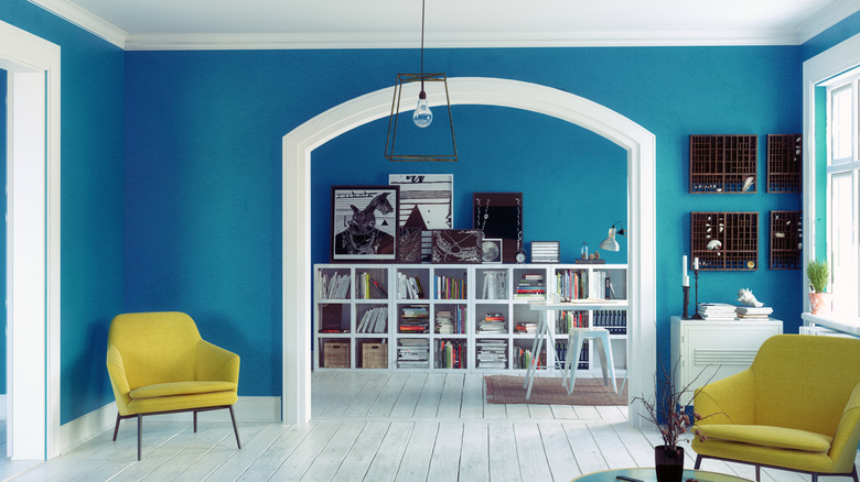 Blue walls with white trim and yellow accents