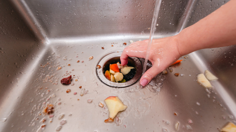 Proper food waste disposal demonstrated with a sink garbage disposal unit