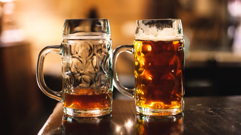 two glass beer mugs