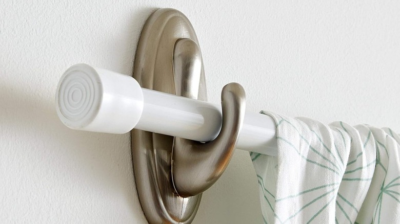 A curtain rod hanging on a Command Hook