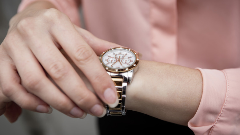 A person looking at their watch