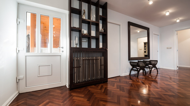 Entryway with shiny herringbone hardwood floors