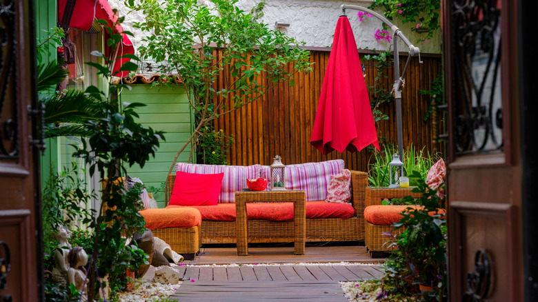 A private deck with vibrant furnishings and textiles
