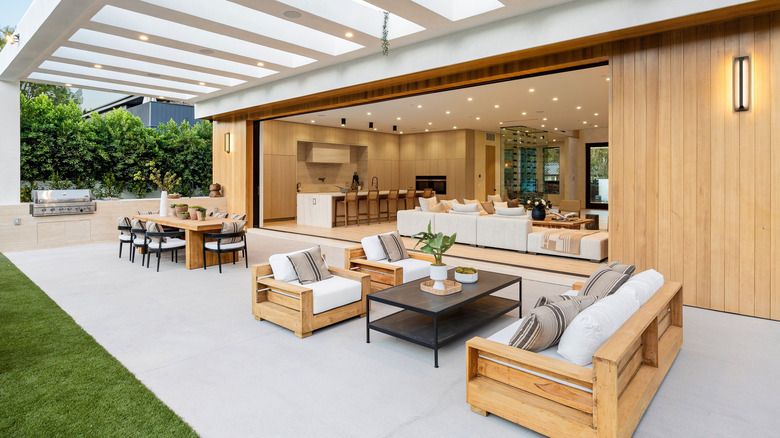 A patio that connects to an open living room with sleek contemporary furnishings