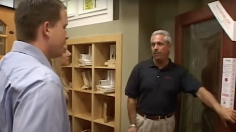 two men and a wooden door
