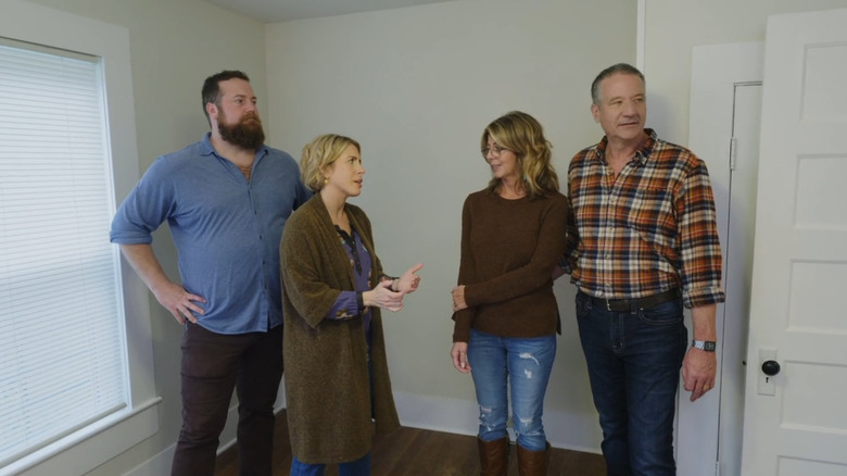 Ben and Erin Napier talking to a couple.