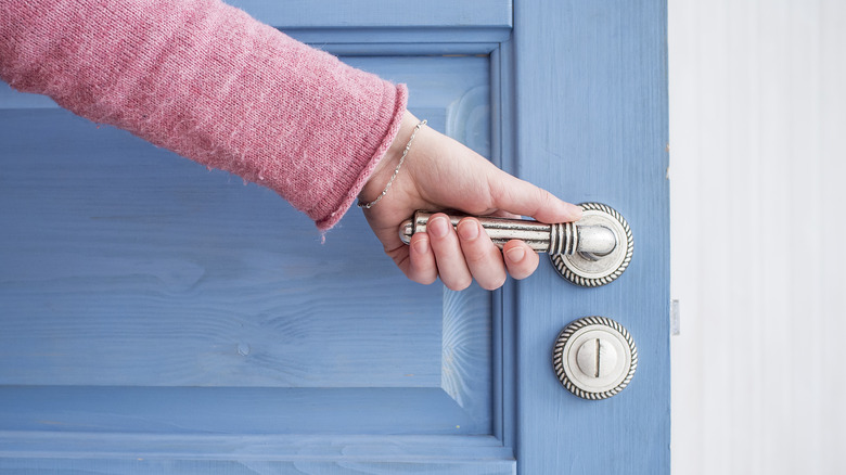 opening door to house