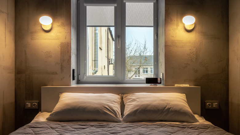 neutral bed up against a window