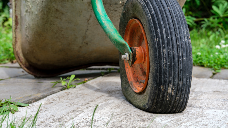 Closeup of flat tire on wheelbarrow