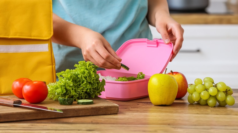 Person packing lunch box