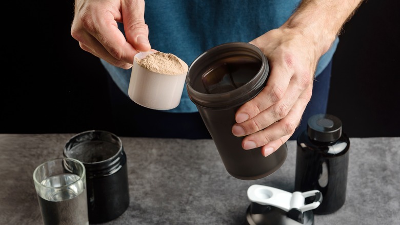 Person making protein shake drink