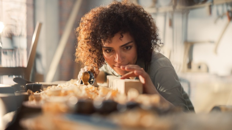 Woman working on wood project