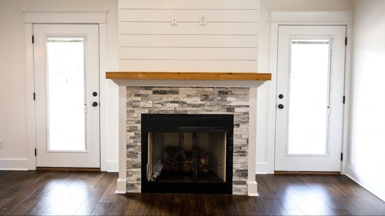 Wood and gray stone mantel