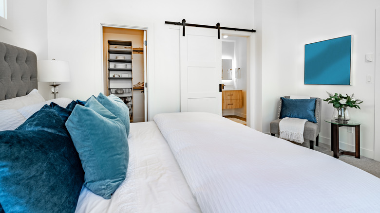 barn door on a master bath entry from the bedroom