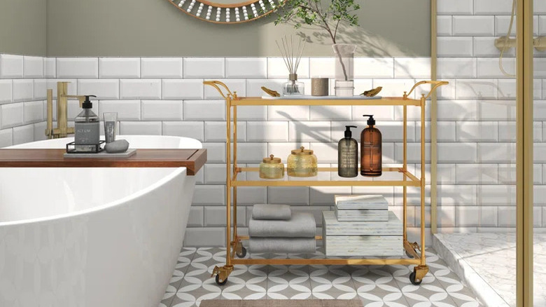 A gold bar cart in a bathroom