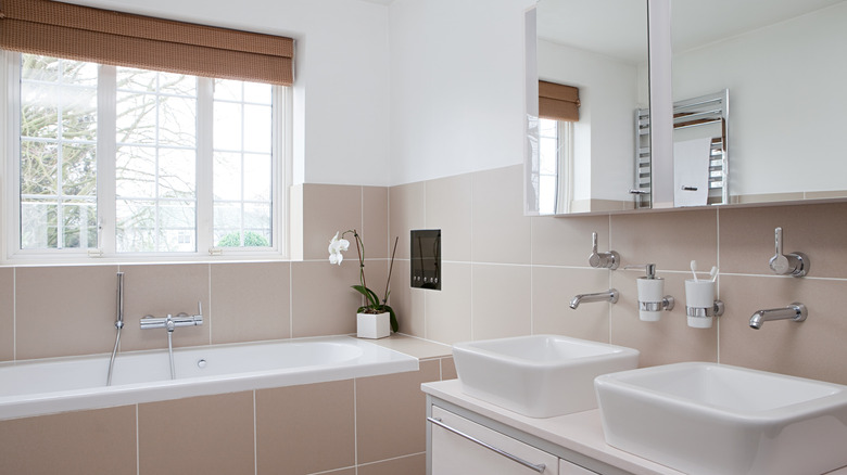 Dated bathroom with pink tones