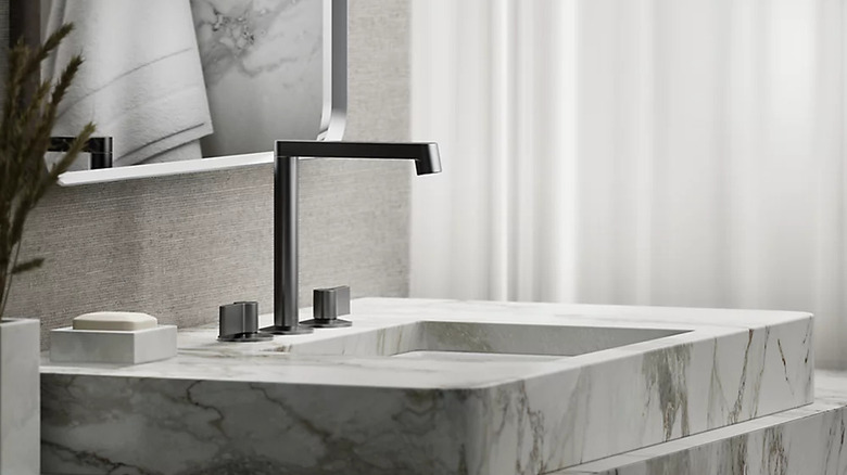 Brushed graphite faucet in modern bathroom