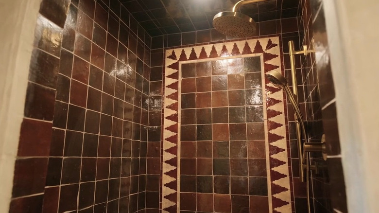 Brown and beige tiled shower wall