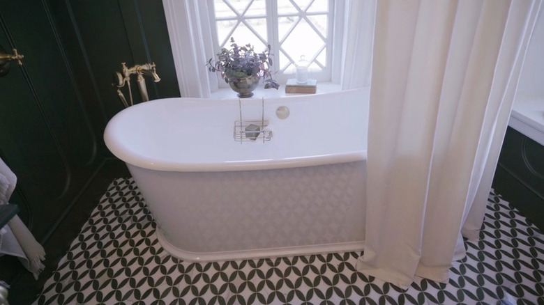 A bathtub against a white window