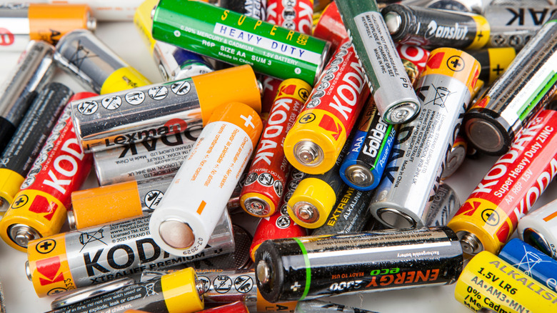 pile of various AA batteries