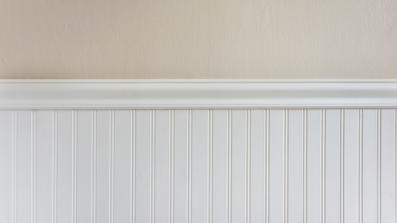 white beadboard on beige wall