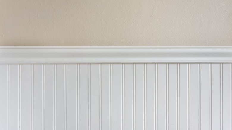 white beadboard on beige wall