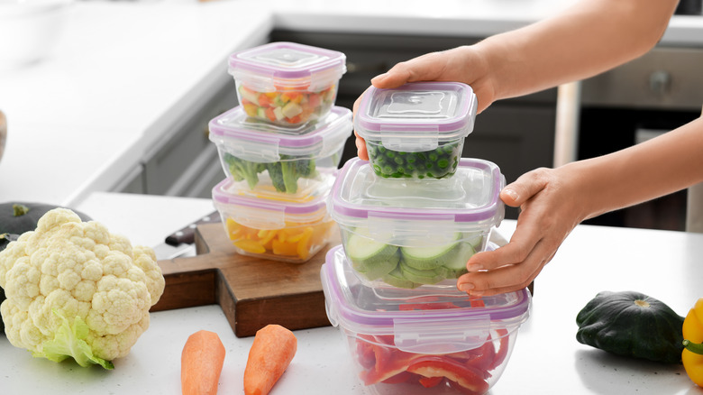 Person stacking containers