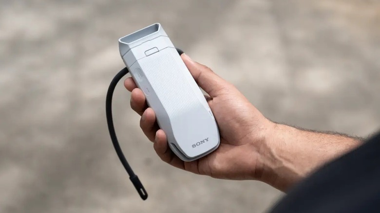 Person holding a Sony personal air conditioner