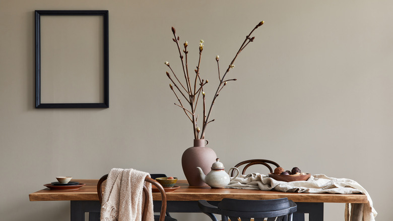 branches in vase on table