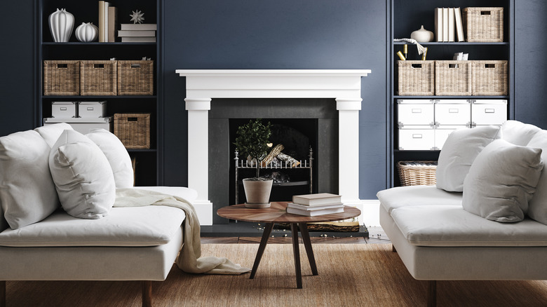 White fireplace against blue wall