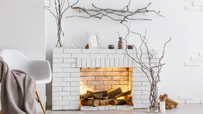 White fake fireplace with branches