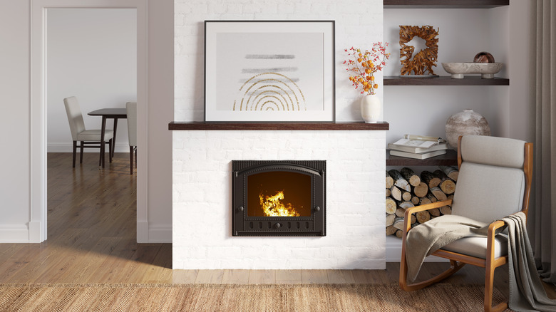 White fireplace with large picture