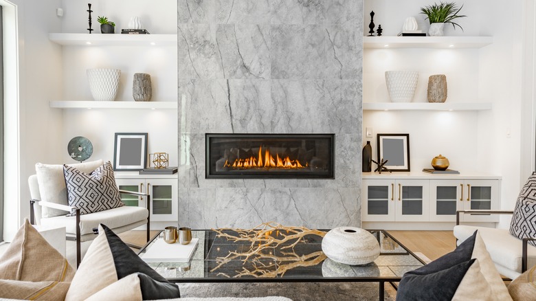 Shelves around a fake fireplace
