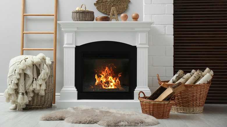 Wicker baskets beside a fireplace